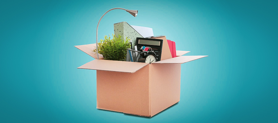 Cardboard box full of office supplies