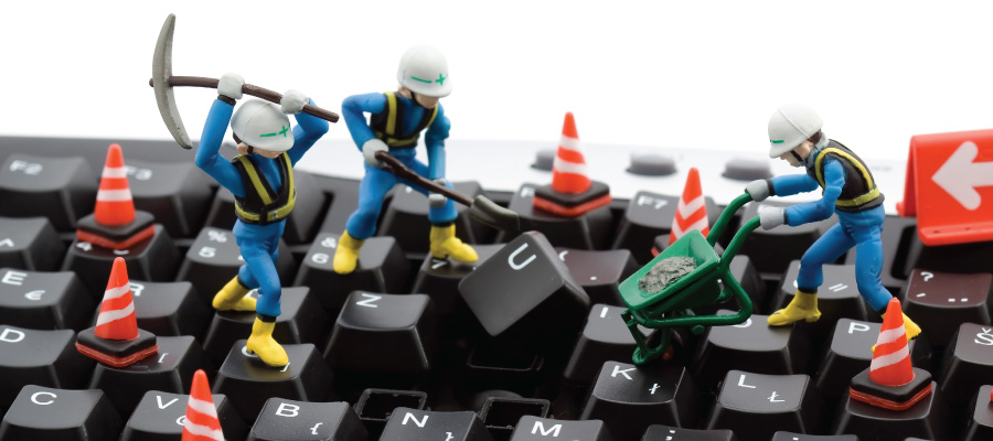 Construction Crew working on a computer keyboard
