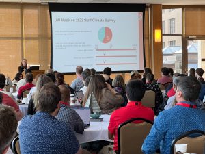 CIO Lois Brooks delivers a keynote address to a full room of conference attendees.