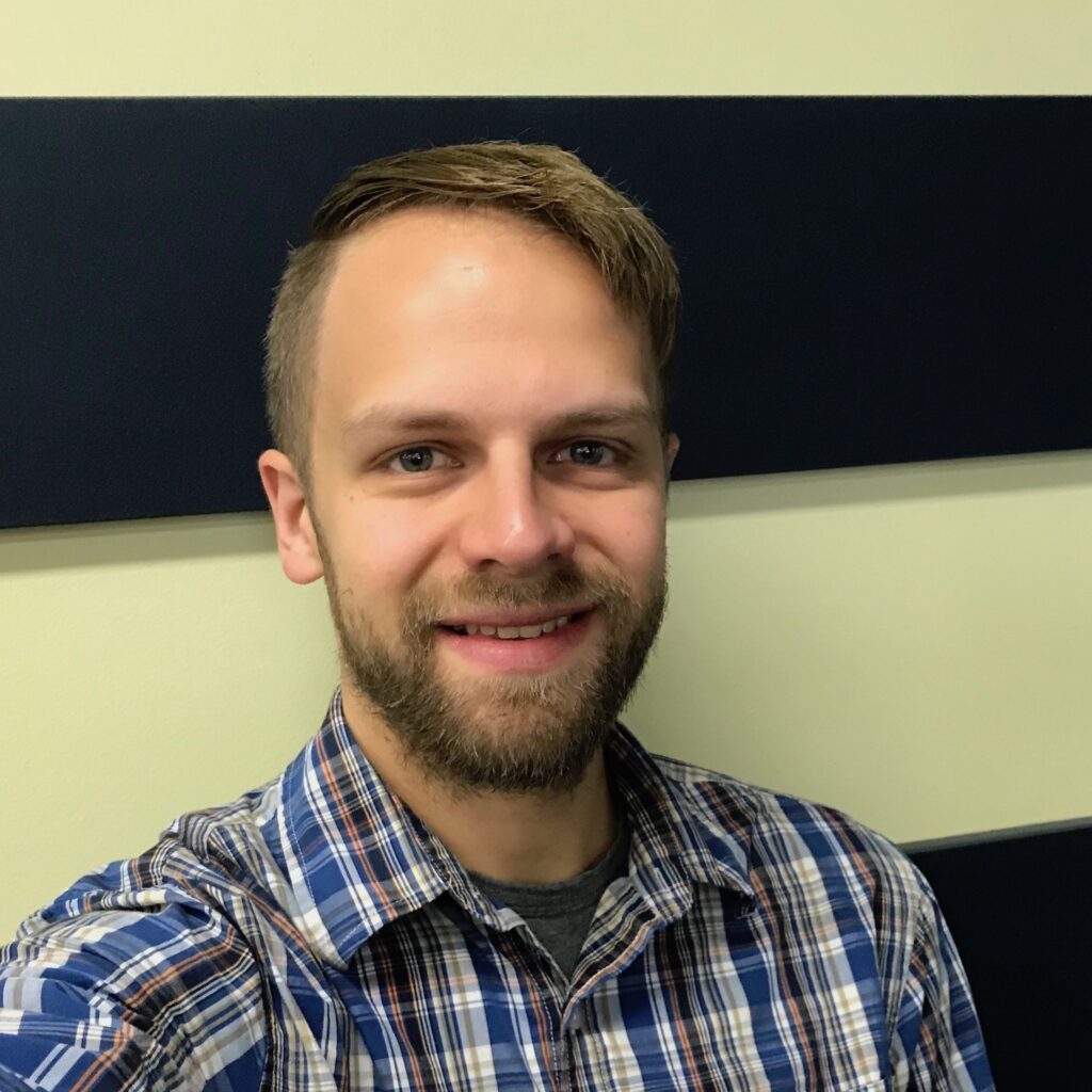 head and shoulders portrait of Jay Ray