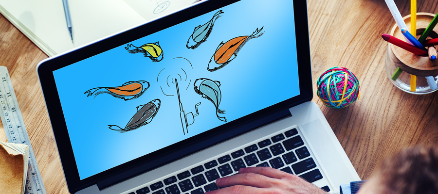 Laptop with multiple fish around a fishing pole on screen.