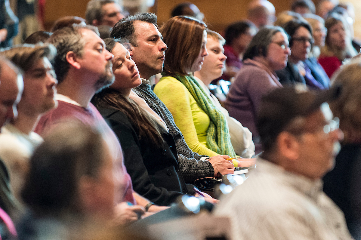 Faculty and staff in large meeting