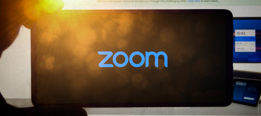 Blue background with a video camera icon in a circle and the word "zoom"